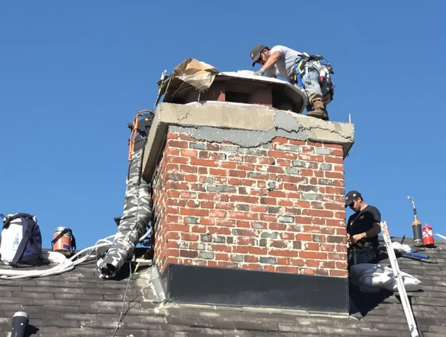 Parma Chimney Sweep installing a custom chimney crown in Parma, OH