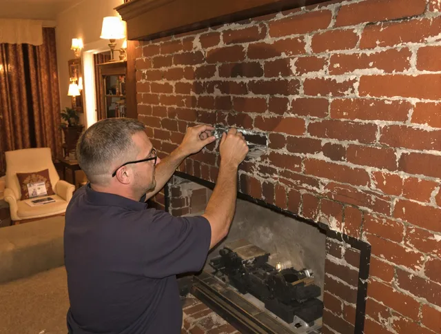 Parma Chimney Sweep expert fixing a fireplace in Parma, OH